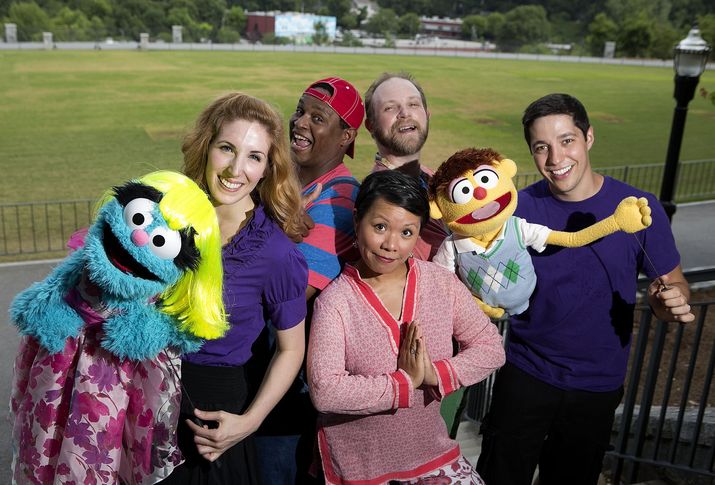 “Avenue Q” cast members Molly Coyne, Spencer Stephens, Matt Nitchie, Natalie Gray and Nick Arapoglou pose at the Promenade green space in Piedmont Park. (Phil Skinner)